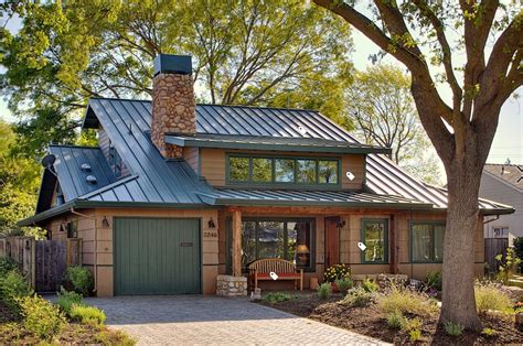 green sidinzg house with metal roof|house with green roof.